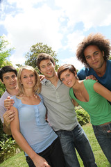 Group of happy students in a park