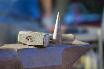 Hammer on anvil