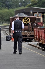 Train guard on platform