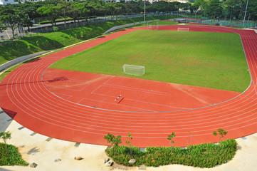 Fototapeta premium Running Track Surrounding A Football Field