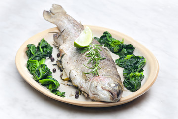 bream baked with Italian herbs and fried spinach