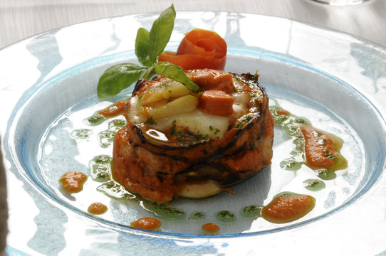 Parmigiana di capesante melanzane e scamorza fum&egrave;