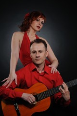 Obraz premium Lovely couple with guitar