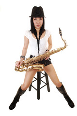 A saxophonist sitting.