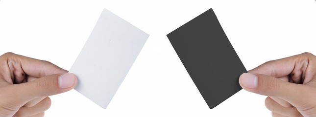 Obraz premium hand holding white and black card