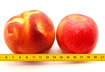 Peach, apple and ruler