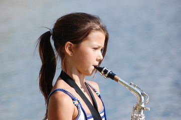 Teen girl with saxophone