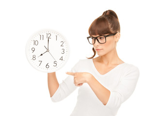 woman holding big clock