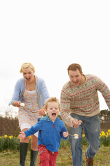 Fototapeta premium Family Having Egg And Spoon Race