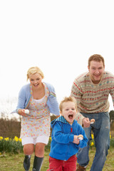 Family Having Egg And Spoon Race