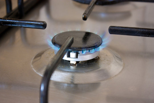 Gas cooker burner on stainless steel stove