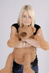 beautiful young blond woman with teddy bear