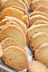 Pastry cakes with sugar on plate.