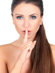 Portrait of beautiful woman, she doing quiet gesture
