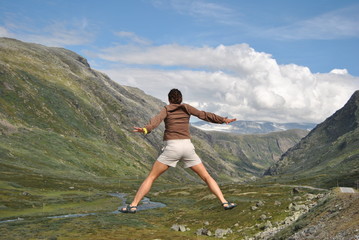 women jumping in the mountain air