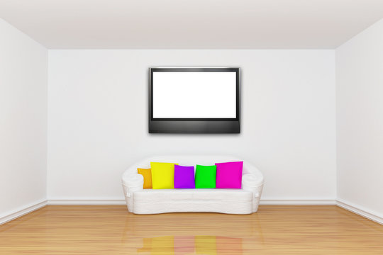 room with white couch and LCD tv