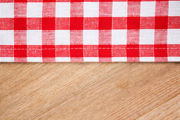 checkered tablecloth on wooden table