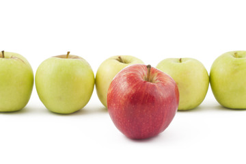 Red apple ahead of the green on white