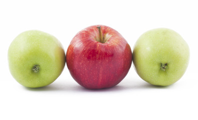 red and two green apples on white