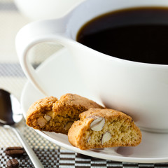 Closeup of cantuccini and a cup of coffee