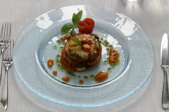 Parmigiana di capesante melanzane e scamorza fum&egrave;