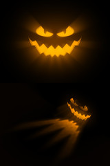 An iluminated pumpkin face on a black background