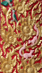 Thai art carving on window of temple, Wat Ra Han, Buriram