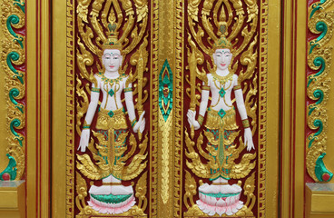 Fototapeta na wymiar Thai art carving on door of temple, Wat Ra Han, Buriram