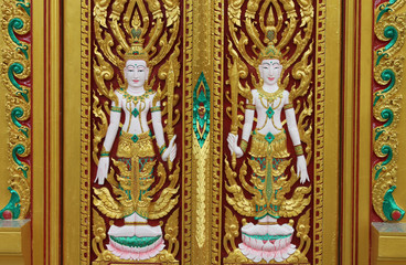 Thai art carving on door of temple, Wat Ra Han, Buriram