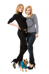 Two beautiful young women with dog
