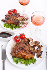 servings of pork chop with mushrooms and vegetables