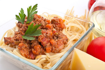 serving of spaghetti bolognese with ingredients