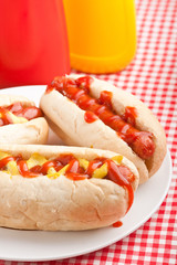 group of hot dogs, on checked table-cloth table