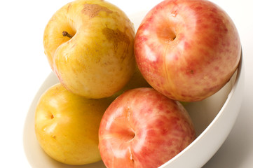 yellow green sweetie and red pluot fruits