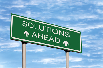 Solutions Ahead Road Sign Over Skyscape