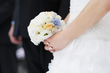Bride holding beautiful wedding bouquet