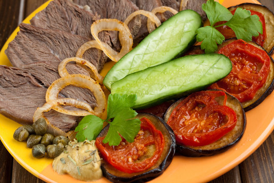 Cold meat with eggplants, tomatoes, cucumbers and onion