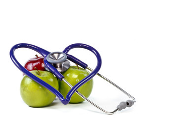 Heart shaped stethoscope with apples and text space