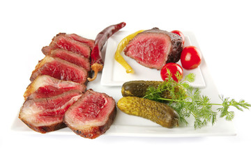 meat sliced with tomatoes and peppers