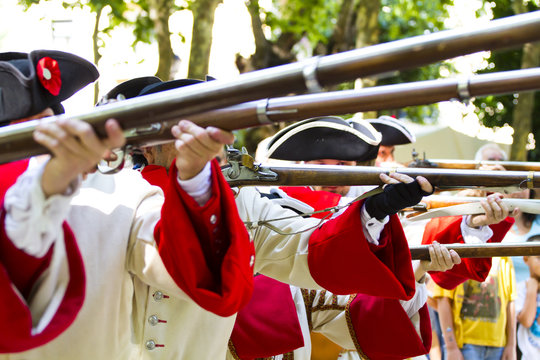 Soldiers firing during the re-enactment of the War of Succession