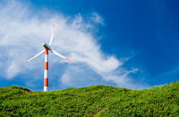 wind turbine in green hill