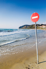One way sign on the beach