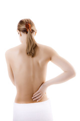 Fototapeta premium Woman massaging pain back isolated on white