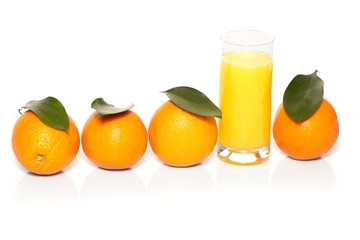 Orange juice and oranges on a white background.
