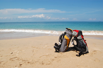 Two backpacks on the tropical beach