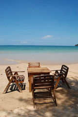 Table and chairs on the tropical beach