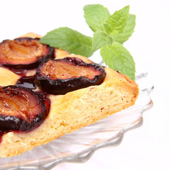 Piece of Plum Pie decorated with a mint twig