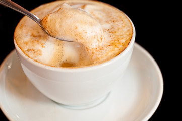 cappuccino isolated on black