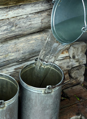 Filling bucket with water
