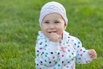 Smiling little girl in the polka dot jacket